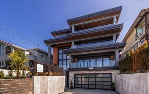 Modern Home Exterior with stone block retaining walls