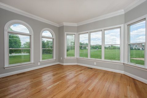 Transitional Sunroom with white crown molding
