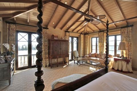Traditional Bedroom with wood cased french doors and windows