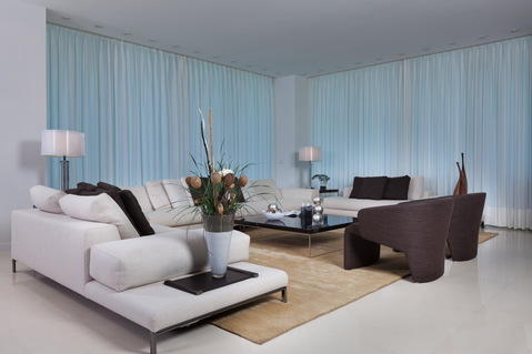 Contemporary Living Room with low black glass coffee table with metal frame