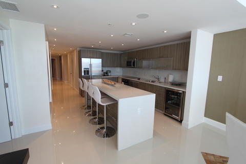 Modern Kitchen with waterfall countertop ledge