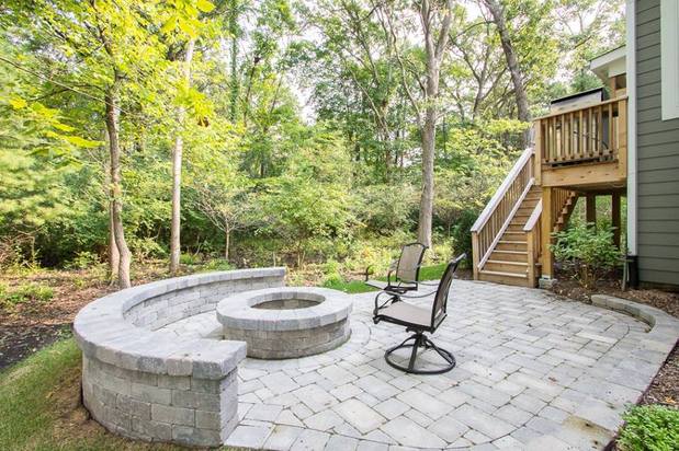 Traditional Patio in Kildeer - brick paver patio, circular stone half wall | by Icon Building Group