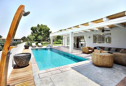 Modern Pool with slat style patio cover
