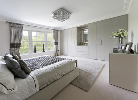 Modern Bedroom with grey flat front cabinetry