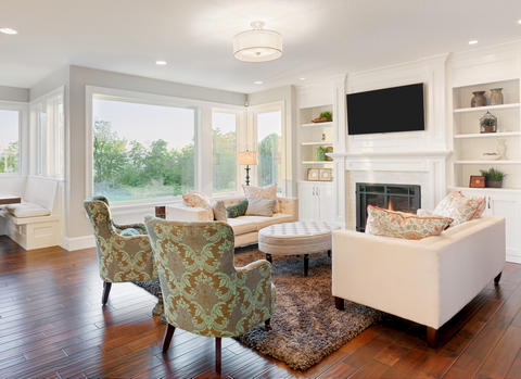 Transitional Family Room with upholstered wingback chairs