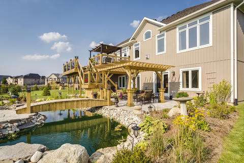Eclectic Landscape with stones lining pond