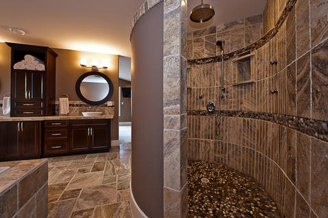 Traditional Bathroom with dark stained recessed panel cabinetry