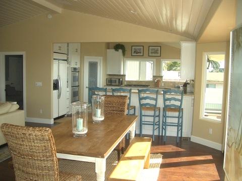 Transitional Dining Room with natural fiber dining area rug