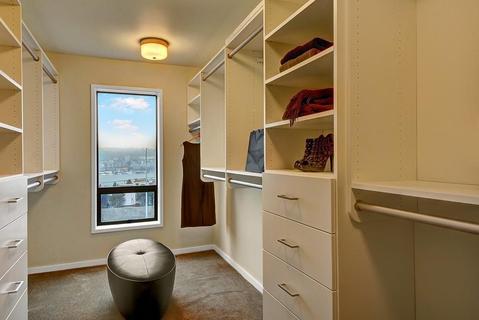 Traditional Closet with beige painted walls