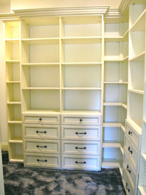 Traditional Closet with white crown molding