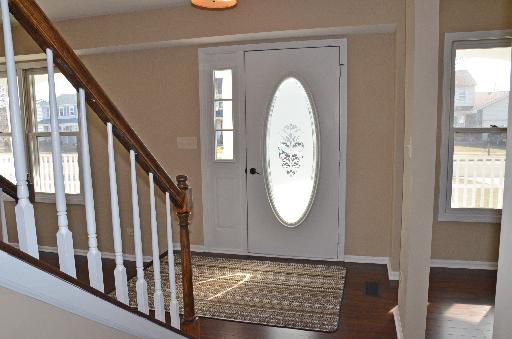 Transitional Entry with oval cut glass door insert