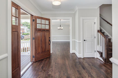 Transitional Entry with cherry wood stained windowed entry door