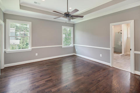 Transitional Bedroom with walnut hardwood finish