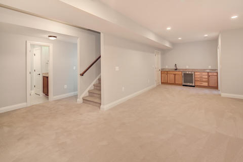 Contemporary Basement with undercounter refrigerator