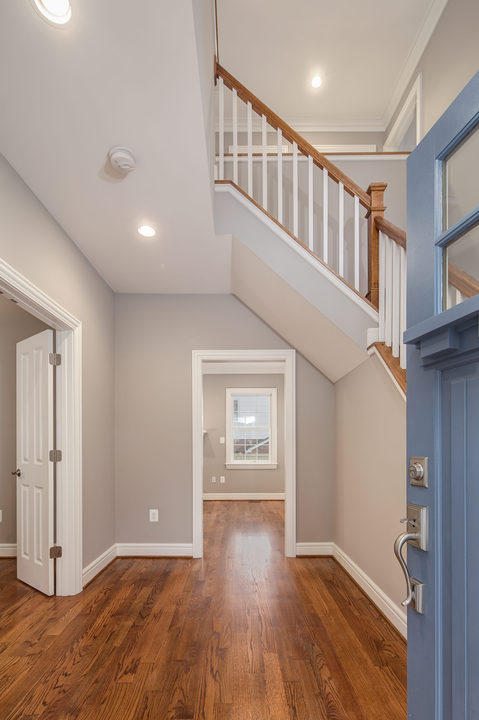 Transitional Entry with high windows in entry door