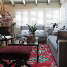 Eclectic Family Room with red brick rounded fireplace
