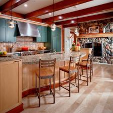 Traditional Kitchen with river rock fire place surround