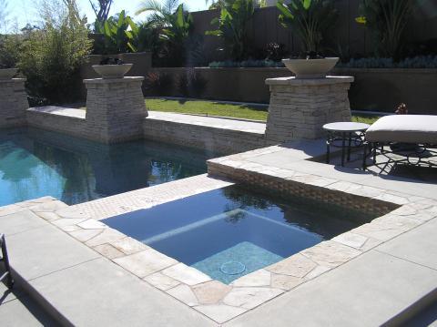 Traditional Pool with wrought iron accents
