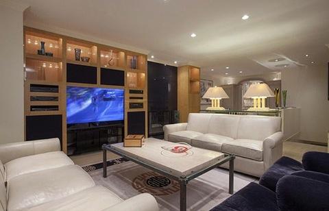 Eclectic Family Room with light wood built in entertainment center