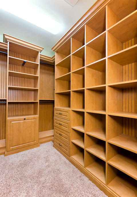 Traditional Closet with fluorescent lighting