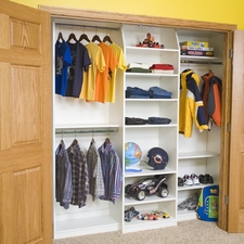 Traditional Closet with beige carpet flooring