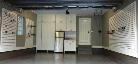 Contemporary Garage with slatted wall storage system