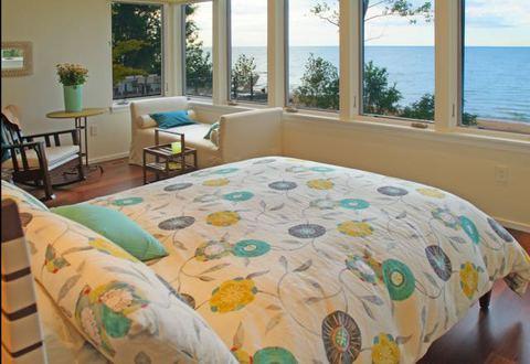 Contemporary Bedroom with wall to wall windows