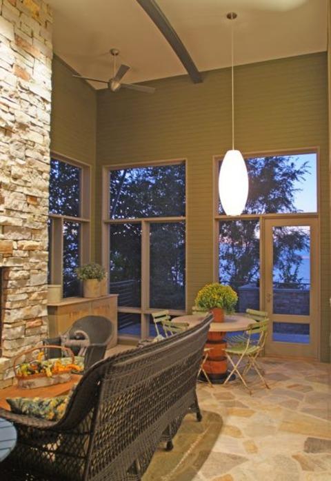 Contemporary Sunroom with antique green slatted dining chairs