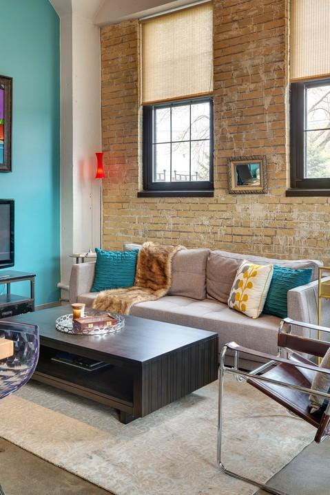 Eclectic Family Room with metal framed corbusier chair