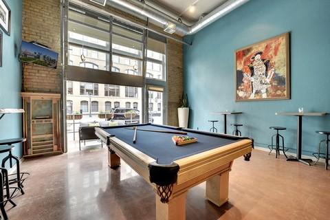 Eclectic Family Room with industrial building remodeled to a home