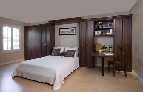 Traditional Bedroom with dark stained cabinet