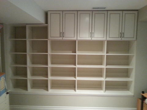 Transitional Basement with off white glazed cabinetry