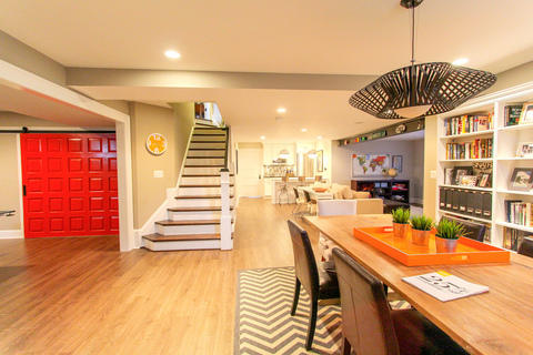 Transitional Dining Room with white built in bookshelves