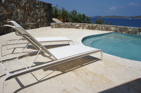 Contemporary Pool with stacked stone retaining wall