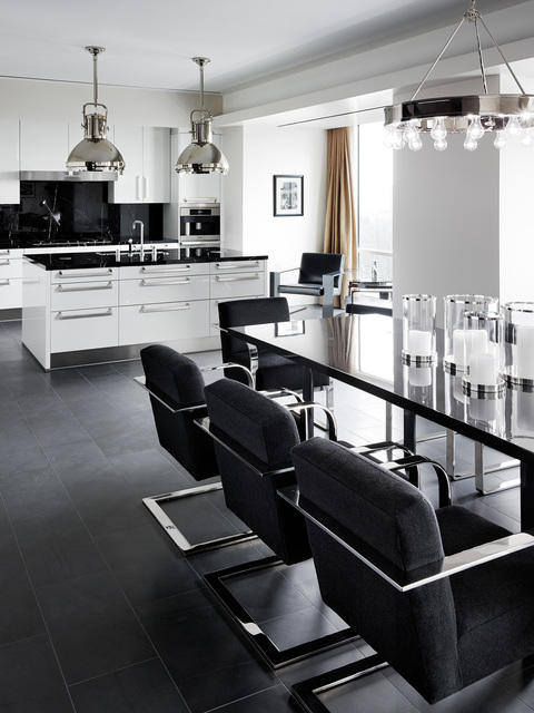 Modern Kitchen with black upholstered dining chairs with chrome arm rests
