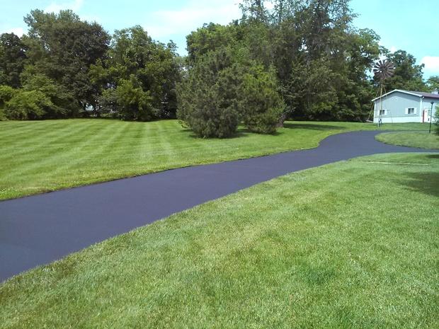 Cottage Driveway with large grassy surrounding land
