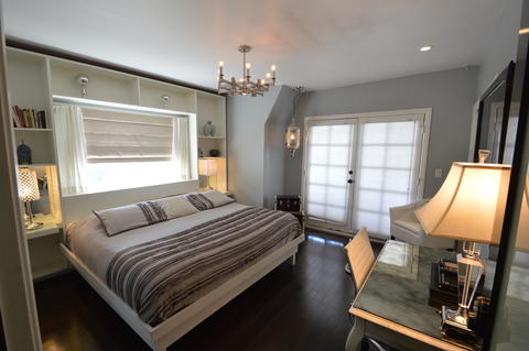 Transitional Bedroom with brushed nickel old world style chandelier