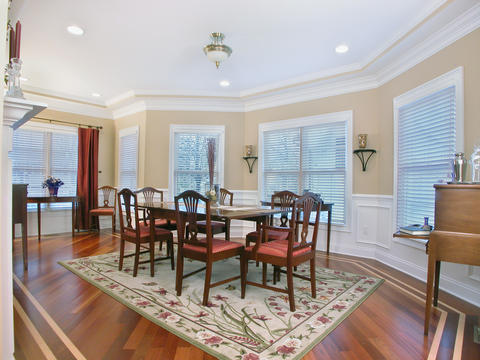 Traditional Dining Room with white crown molding