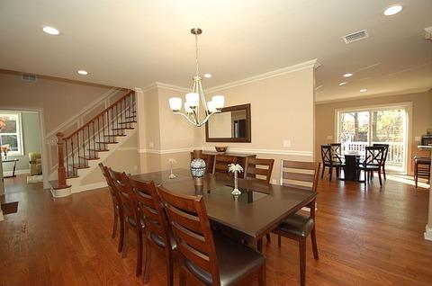 Transitional Dining Room with wood ladder back dining chairs