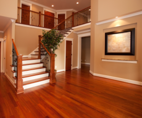 Traditional Entry with cherry stained handrails and wrought iron balusters