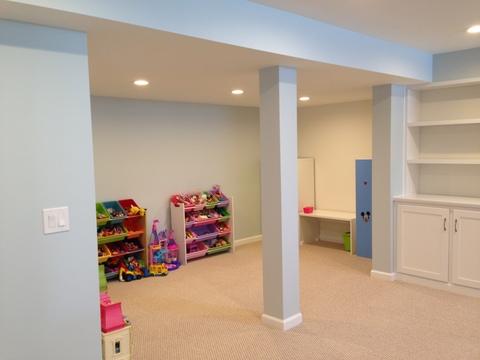 Traditional Basement with white built in cabinetry