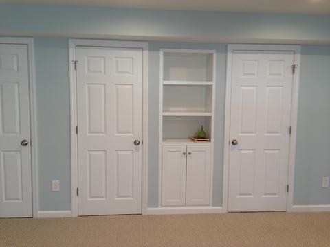Traditional Basement with built in wall cabinet