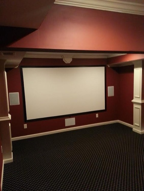 Traditional Home Theater with blue carpet flooring