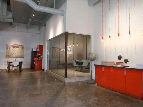 Contemporary Home Office with glass walls around conference room