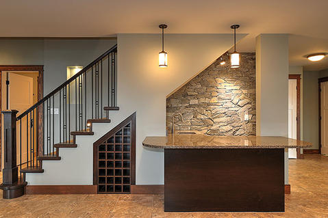 Modern Basement with dark wood slab panel cabinet base