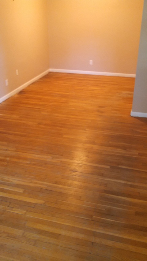 Transitional Dining Room with refinished hardwood flooring