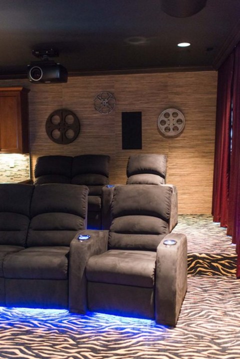 Eclectic Home Theater with under chair neon lighting
