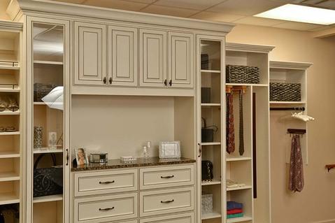 Modern Closet with recessed panel cabinet face with glazed accents