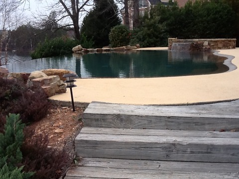 Transitional Pool with natural stone waterfall