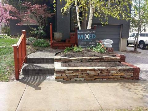 Eclectic Landscape with ledger stone raised flower beds